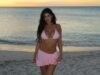 Kylie Jenner revela seu abdômen de cair o queixo em um biquíni minúsculo depois de levar amigos para uma viagem à ilha paradisíaca