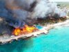 Pelo menos um turista morto após um grande incêndio quase destruir resort caribenho, 1.690 evacuados