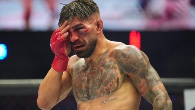 Ilia-Toupruia-touches-swollen-face-during-UFC-Freedom-250.jpg