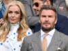 David Beckham senta-se desajeitadamente perto de Katherine Jenkins em Wimbledon após rivalidade