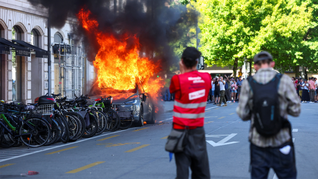 un-offices-smashed-tesla-fire-protest.png