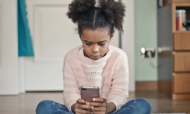 A-young-girl-using-a-phone.jpg