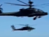 Se levantan las suspensiones de los pilotos de Apache después de un sobrevuelo sobre una playa de Carolina del Sur